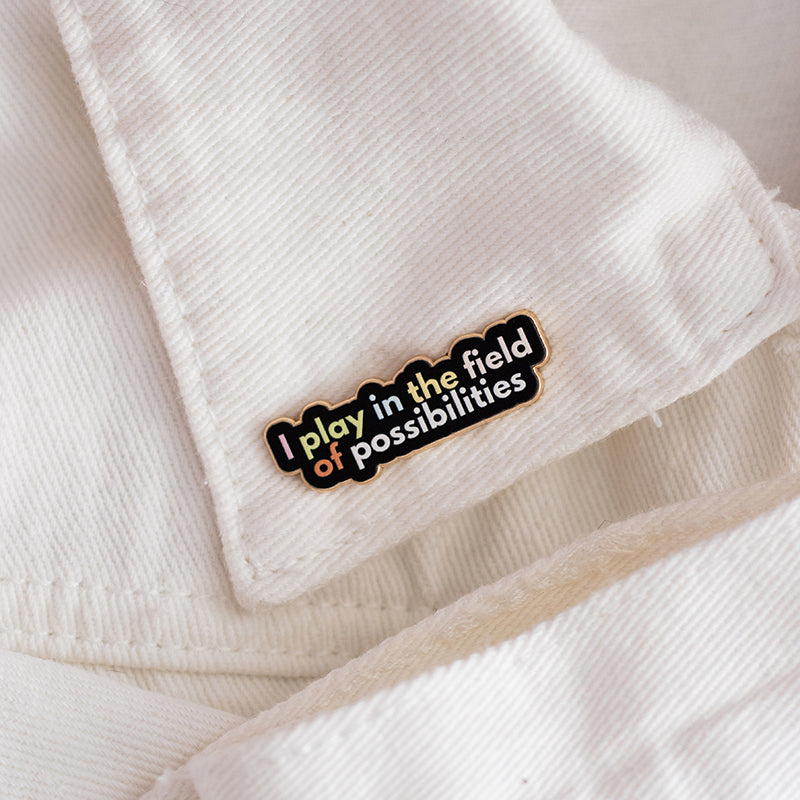 RETIRING Play in the Field of Possibilities Text Enamel Pin
